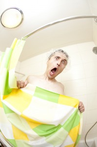 Wash or replace shower curtains regularly to illustrate shower tips by Mini Mops House Cleaning