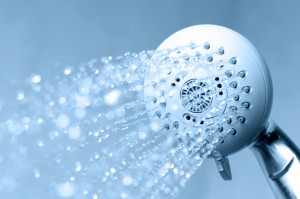 Shower with running water to illustrate shower tips by Mini Mops House Cleaning